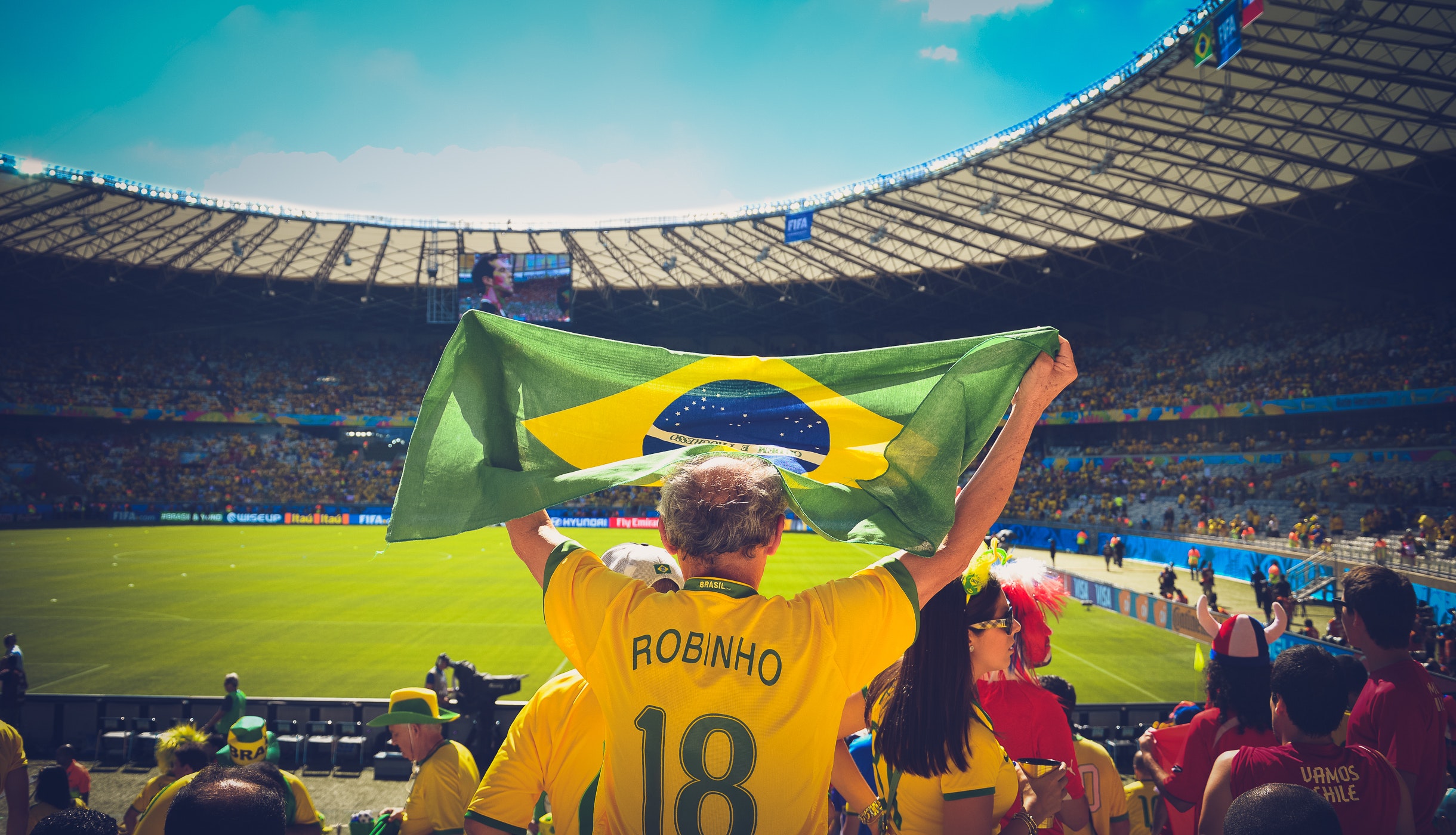People are cheering for the Brazilian team